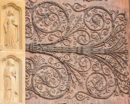 Details of Notre Dame de Paris Cathedral in France - sculpture and bas reliefs on the main entrance...
