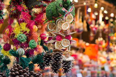 Christmas market in details. Handmade Christmas decoration from natural materials - tangerine, leaves, cinnamon, seeds, conesの写真素材