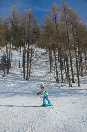 Stunning view of the mountains and child skier in Obertauern ski resortの写真素材