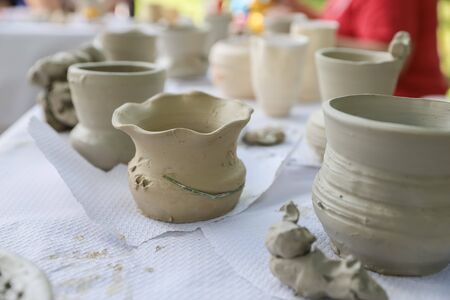 Freshly made on potter's wheel: vases, pots, jars and platesの写真素材