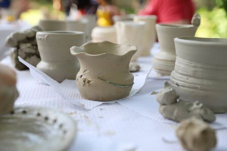 Handmade clay products: vases, pots, jars and platesの写真素材