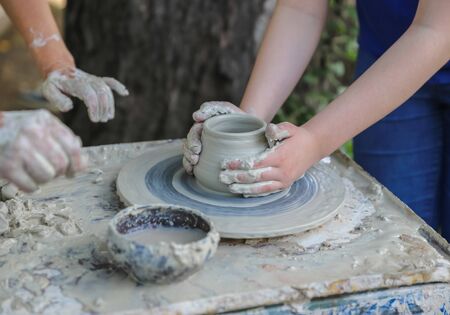Hands on a potters wheel - master class for children and adultsの写真素材