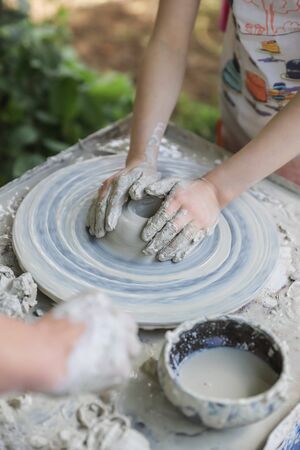 Hands on a potters wheel - master class for children and adultsの写真素材