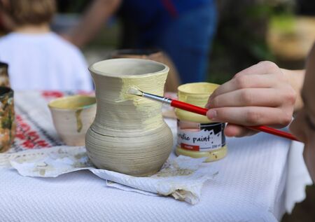 Handmade clay product coloring: vases, pots, jars and platesの写真素材