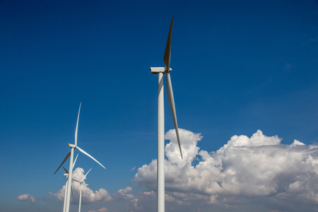Wind turbine eco power for electric with blue sky background.の写真素材