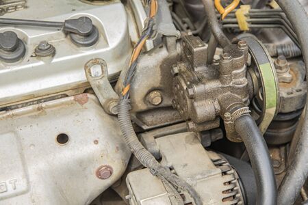 Power steering pump is leaking oil from gasket.