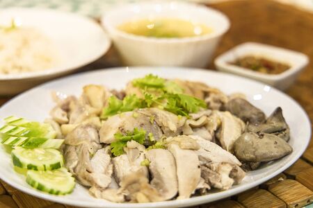 Stream chicken with white rice and soup and dipping sauce 0n the table. Selective focus.の写真素材