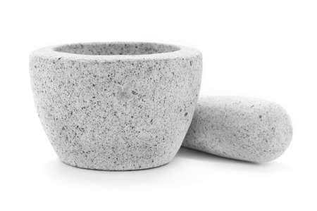 A Gray granite mortar and pestle isolate on a white background.の写真素材