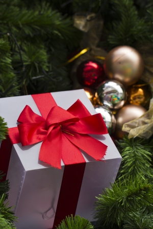 close up of gift and decorated christmas treeの写真素材