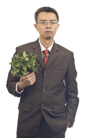 Asian businessman standing on white backgroundの写真素材