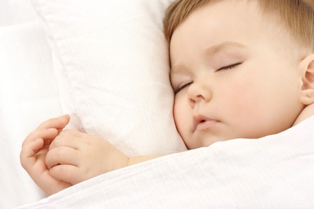 Cute child is sleeping, high key portraitの写真素材