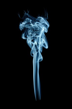 Blue torch-shaped smoke, isolated over blackの写真素材
