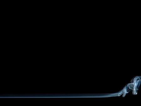 Black background with a tiny smoke strip at the bottom, isolated over blackの写真素材