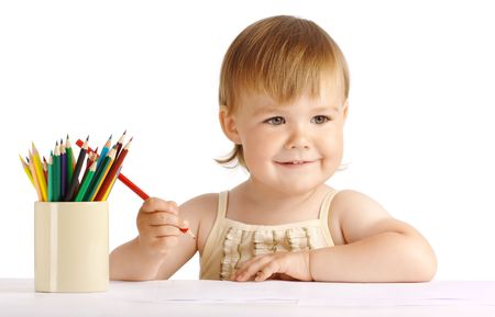 Happy child draw with red crayon, isolated over whiteの写真素材