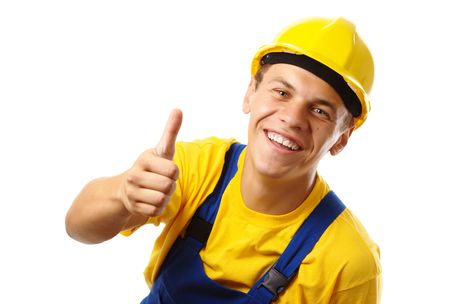 Young construction worker showing thumb up sign, isolated over whiteの写真素材