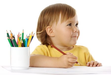 Happy child draw with crayon, isolated over whiteの写真素材