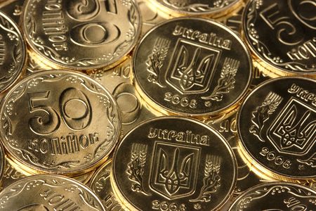 Extreme closeup of a shiny golden coinsの写真素材