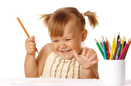 Happy child play with color pencils and smile, isolated over whiteの写真素材