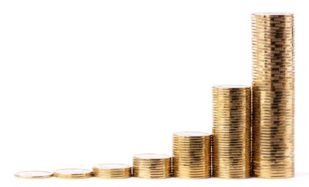 Increasing piles of golden coins, growing wealth concept, isolated over whiteの写真素材