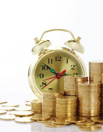 Old-fashioned clock dial on golden coins background, time is money concept, isolated over whiteの写真素材
