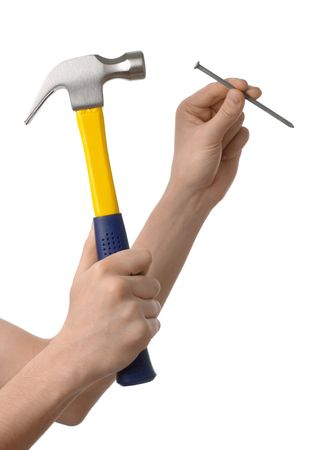Hammering a nail, hands only, isolated over whiteの写真素材
