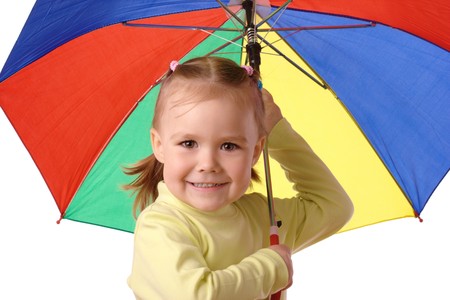 Cute cheerful child with colorful umbrella, isolated over whiteの写真素材