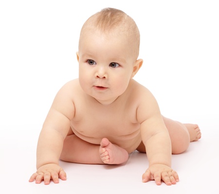 Happy child is sitting on floor, isolated over whiteの写真素材