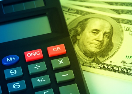 Calculator and few hundred dollars - accounting conceptの写真素材