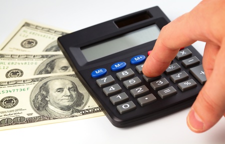 Calculator and few hundred dollars - accounting conceptの写真素材