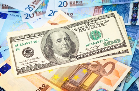 Few hundred dollars on top of Euro, can be used as a backgroundの写真素材