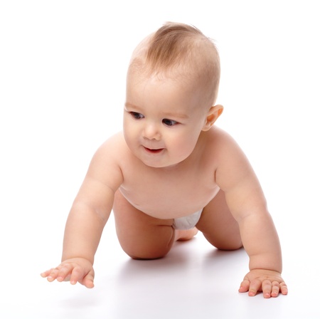 Happy child is crawling on floor, isolated over whiteの写真素材