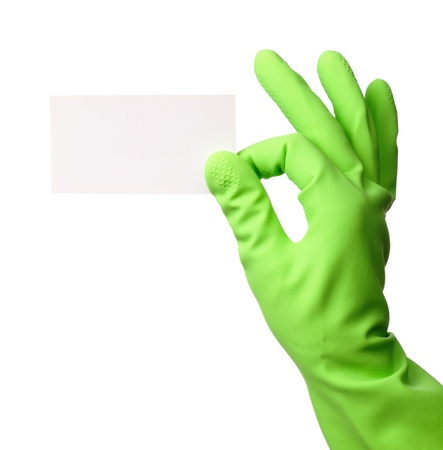 Hand in green rubber glove showing blank business card, isolated over whiteの写真素材