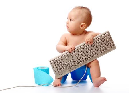 Little child is typing while sitting on potty, isolated over whiteの写真素材