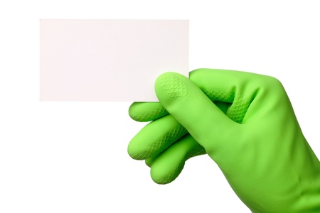 Hand in green rubber glove showing blank business card, isolated over whiteの写真素材