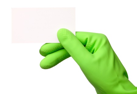 Hand in green rubber glove showing blank business card, isolated over whiteの写真素材