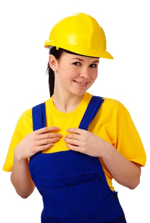 Young happy attractive woman in construction uniform, isolated over whiteの写真素材