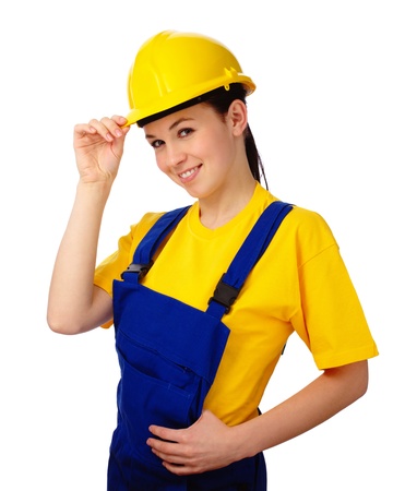 Young happy attractive woman in construction uniform, isolated over whiteの写真素材