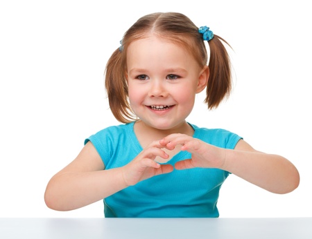 Portrait of a cute little girl, isolated over whiteの写真素材