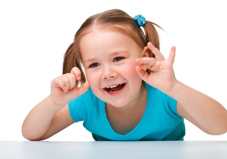 Portrait of a cute little girl, isolated over whiteの写真素材