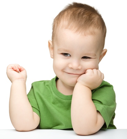 Portrait of a cute and happy little boy, isolated over whiteの写真素材