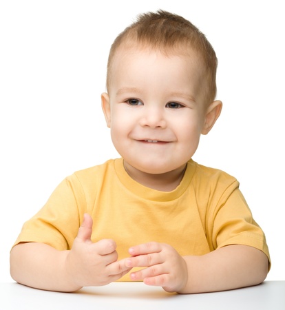Portrait of a cute and happy little boy, isolated over whiteの写真素材