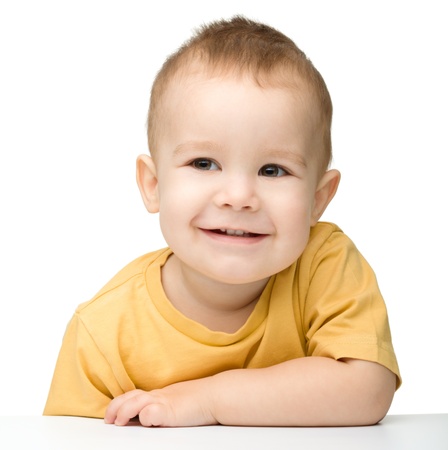 Portrait of a cute and happy little boy, isolated over whiteの写真素材