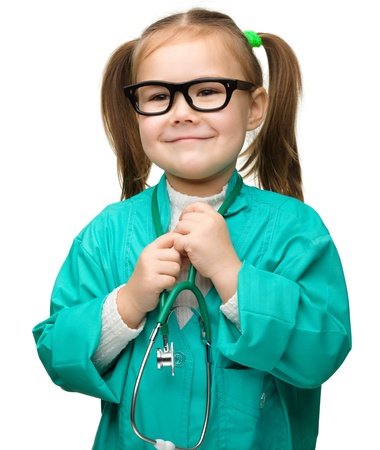 Cute little girl is playing doctor, isolated over whiteの写真素材