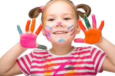 Portrait of a cute cheerful girl with painted hands, isolated over whiteの写真素材