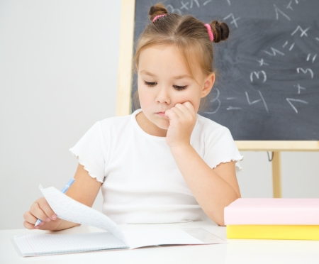 Cute little girl is studying in preschoolの写真素材