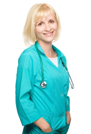 Portrait of a happy young attractive woman wearing doctor uniform, isolated over whiteの写真素材