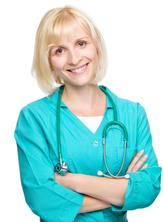 Portrait of a young attractive woman wearing doctor uniform, isolated over whiteの写真素材