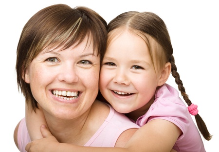 Portrait of a happy daughter piggyback ride her mother, isolated over whiteの写真素材