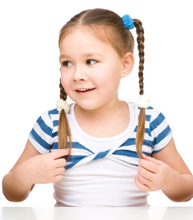 Portrait of a cute little girl, isolated over whiteの写真素材