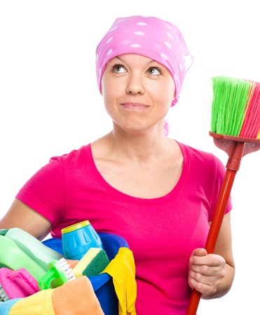 Young woman is dressed as a cleaning maid, holding broom and bucket full of liquids, looking up, isolated over whiteの写真素材